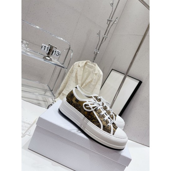 Dior Beige Floral Pattern Platform Trainers - On Box View Dior beige floral pattern platform trainers resting on product shoe box