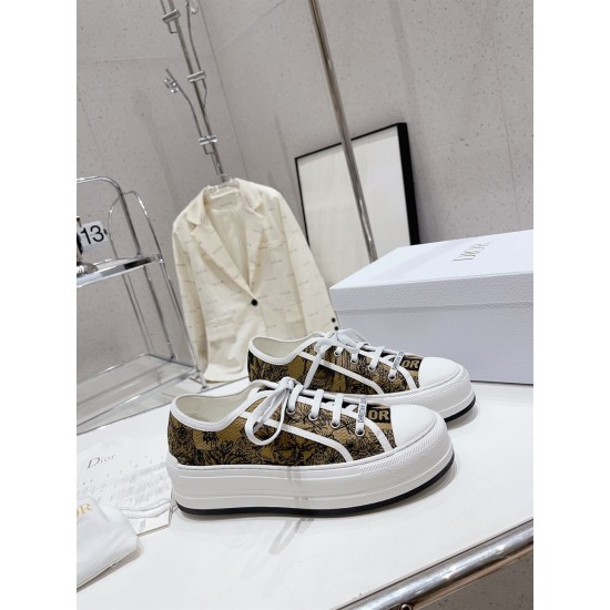 Dior Beige Floral Pattern Platform Trainers - Pair Perspective Pair of Dior beige and black floral pattern platform trainers angled on table