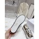 Dior Beige Floral Pattern Platform Trainer - Outsole View Underneath tread pattern view of Dior white platform sole with star graphic in beige
