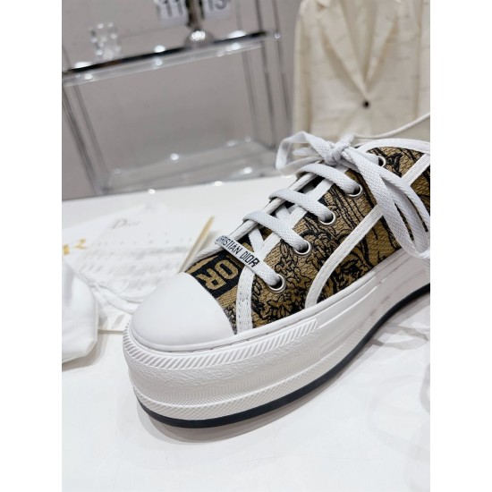 Dior Beige Floral Pattern Platform Trainer - Lacing Detail Close-up of white laces, eyelets and branded tongue on Dior beige floral trainer