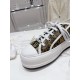 Dior Beige Floral Pattern Platform Trainer - Lacing Detail Close-up of white laces, eyelets and branded tongue on Dior beige floral trainer