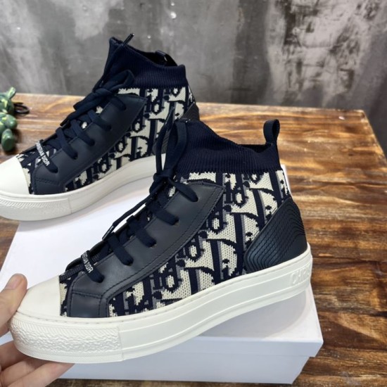 Pair of Dior Walk'n'Dior dark blue oblique canvas high top trainers angled view