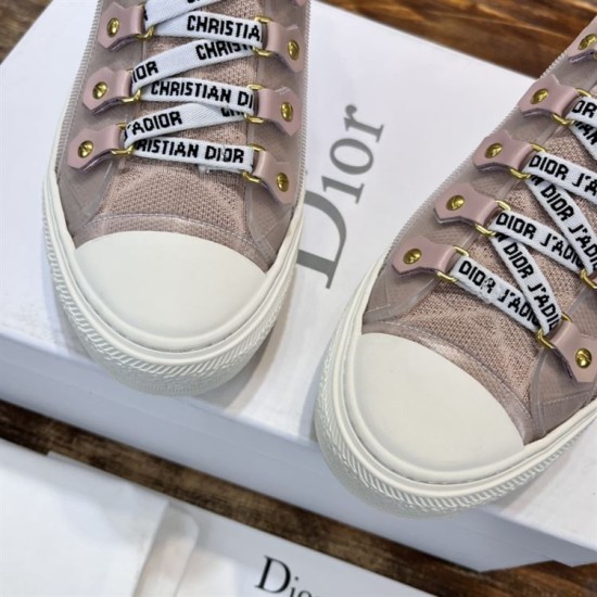 Close-up of signature ribbon laces and eyelet tabs on Dior Walk'n'Dior high-top knit pink trainers