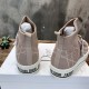 Rear view showing heel design and pull tabs of Dior Walk'n'Dior high-top knit pink trainers