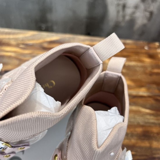 Top-down view inside the collar of Dior Walk'n'Dior high-top knit pink trainers showing insoles