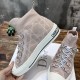 Angled view showing the inner side and sole detailing of Dior Walk'n'Dior high-top knit pink trainer