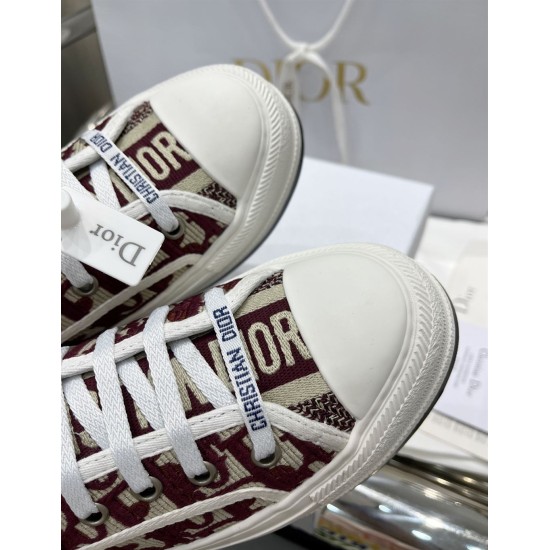 Dior Walk'n'dior Toe Cap Detail in burgundy Close-up of white rubber toe caps and branded laces on Dior burgundy trainers