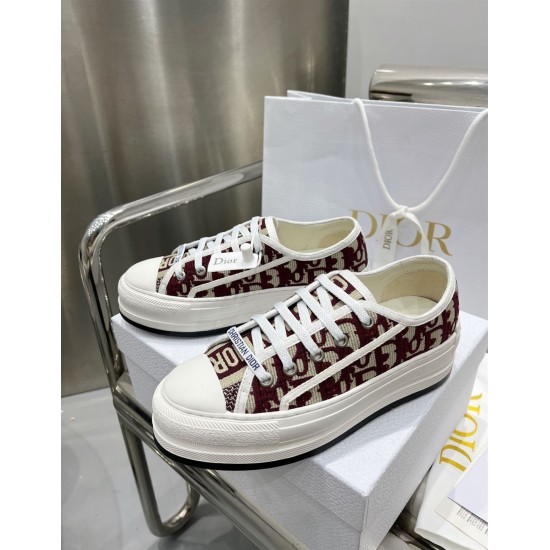 Angled Pair View of Dior Walk'n'dior Trainers in burgundy Side angled pair view of Dior Walk'n'dior low top trainers in burgundy canvas