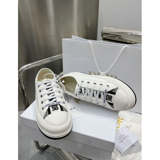 Dior Walk'n'dior White Canvas Trainers Front Angle Front elevated view of Dior Walk'n'dior white trainers resting on box