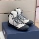 Pair of Grey and Black Hiking Boots Three-Quarter View Pair of grey and black hiking boots resting on a navy shoebox