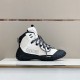 High-Top Hiking Boot Side Profile in grey and black Lateral side view of grey and black high-top hiking boot on white display surface