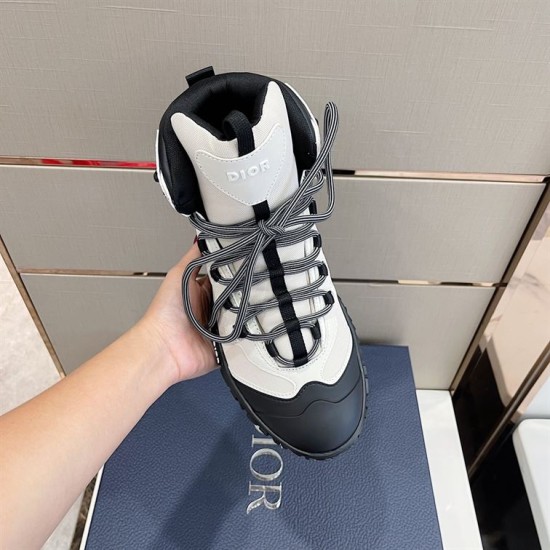 Top-Down Overhead View in grey and black Top-down view of grey hiking boot held in hand showing lace system and toe cap in grey and black