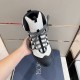 Top-Down Overhead View in grey and black Top-down view of grey hiking boot held in hand showing lace system and toe cap in grey and black