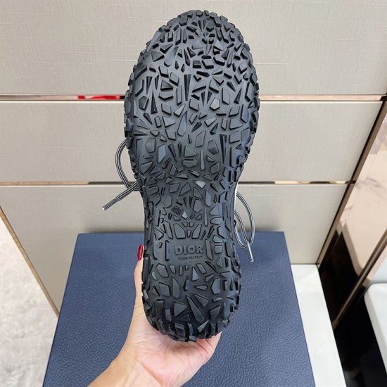 Lugged Rubber Outsole Tread View in grey and black Underneath view of black rubber sole showing heavy geometric tread pattern in grey and black