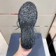 Lugged Rubber Outsole Tread View in grey and black Underneath view of black rubber sole showing heavy geometric tread pattern in grey and black