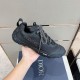 Dior Diorizon Black Technical Shoe Side Detail Hand holding the lateral side of the black Dior Diorizon rubber shoe