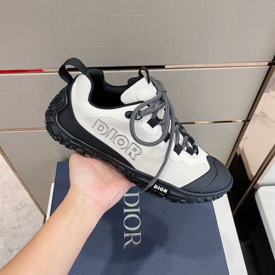 Diorizon Trainer Lateral Side Detail in grey and black Handheld lateral view highlighting side logo and black rubber trim in grey and black