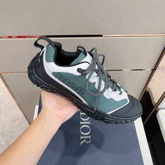 Hand holding Dior Diorizon Technical Mesh Hiking Shoe in green grey displaying side profile