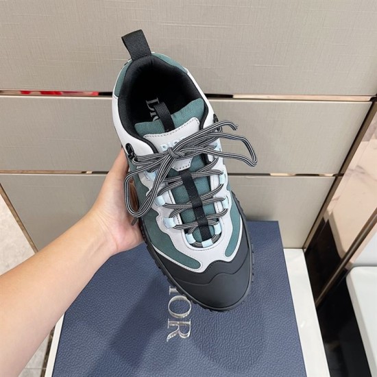 Hand holding top view of Dior Diorizon Technical Mesh Hiking Shoe showing laces in green and grey