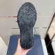 Textured black rubber sole of Dior Diorizon Technical Mesh Hiking Shoe showing tread pattern in green and grey