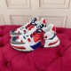 Dolce & Gabbana Airmaster Multicolour Low Top Trainers Angled Pair in multicolour and white Pair of Dolce & Gabbana Airmaster Multicolour Low Top Trainers angled on a red velvet surface in multicolour and white