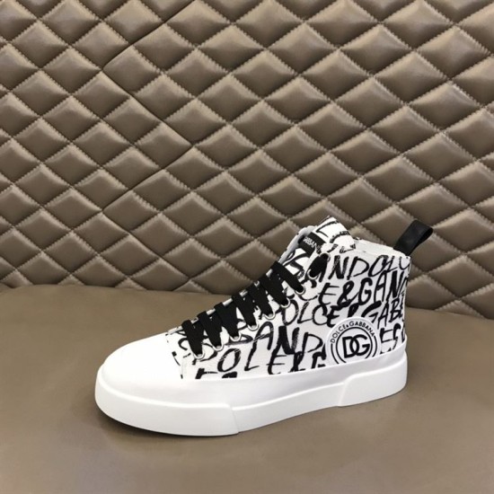 Dolce & Gabbana Portofino Light Canvas Logo Print Mid-Top Trainer resting on a display surface in white and black