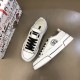 Overhead pair view of white Dolce & Gabbana Portofino Light trainers with black contrast details