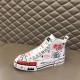 Dolce & Gabbana Graffiti Canvas Mid-Top Trainers Side Profile View in white Dolce & Gabbana white mid-top trainer resting on leather surface showing lateral side detail