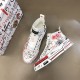 Dolce & Gabbana Graffiti Canvas Mid-Top Trainers Angled View with Box in white Dolce & Gabbana white graffiti mid-top trainers angled perspective with packaging box