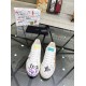 Top-down view of Dolce & Gabbana Portofino Graffiti Print White Leather Trainers showing toe boxes and laces in white and red