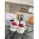 Rear view of Dolce & Gabbana Portofino Graffiti Print White Leather Trainers with pink heel tabs in white and red