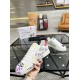 Dolce & Gabbana Portofino Graffiti Print White Leather Trainer held to show ITALY IS BEAUTY motif in white and red