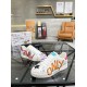 Angled perspective of Dolce & Gabbana Portofino Graffiti Print White Leather Trainers on glass table in white and red