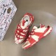 Dolce & Gabbana Space Red Trainers Angle View in red and cream Pair of red Dolce & Gabbana trainers positioned at dynamic angles in red and cream