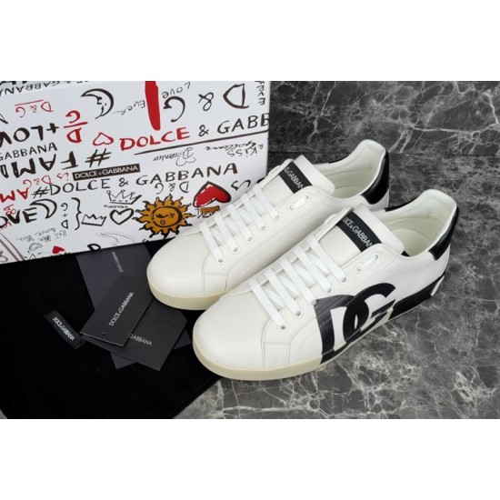 Dolce & Gabbana Portofino White Trainers Pair View Pair of Dolce & Gabbana Portofino white trainers angled near dust bag and shoe box