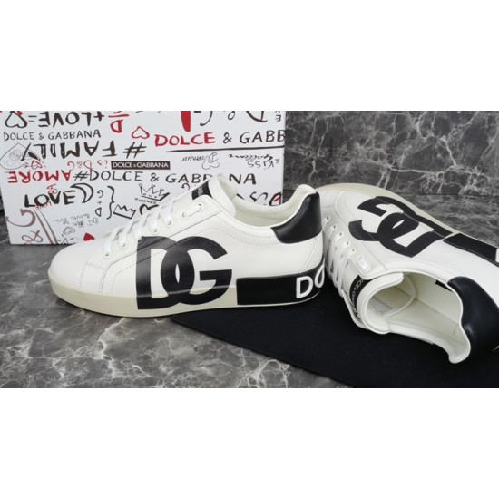 Dolce & Gabbana Portofino White Trainer Profile Side profile of white Dolce & Gabbana Portofino trainer resting beside second shoe