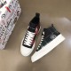Angled top-down view of Dolce & Gabbana Tartan Canvas Mid-Top High-Top Trainers in green