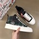 Pair of Dolce & Gabbana Tartan Canvas Mid-Top High-Top Trainers showing mixed green and red tartan uppers