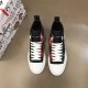 Top-down view of Dolce & Gabbana Tartan Canvas Mid-Top High-Top Trainers showing green and red tartan panels
