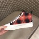 Medial side view of Dolce & Gabbana Tartan Canvas Mid-Top High-Top Trainers featuring red tartan upper in green
