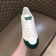 Dolce & Gabbana Portofino Trainer Front Facing in white and green Front perspective of white low-top trainer with green toe cap and tongue patch