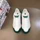 Dolce & Gabbana Portofino Trainers Overhead View in white and green Top-down view of white leather Portofino trainers with green toe caps and branded tongues