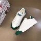 Dolce & Gabbana Portofino Low-Top Trainers Top View in white and green Overhead perspective of two white and green leather low-top trainers
