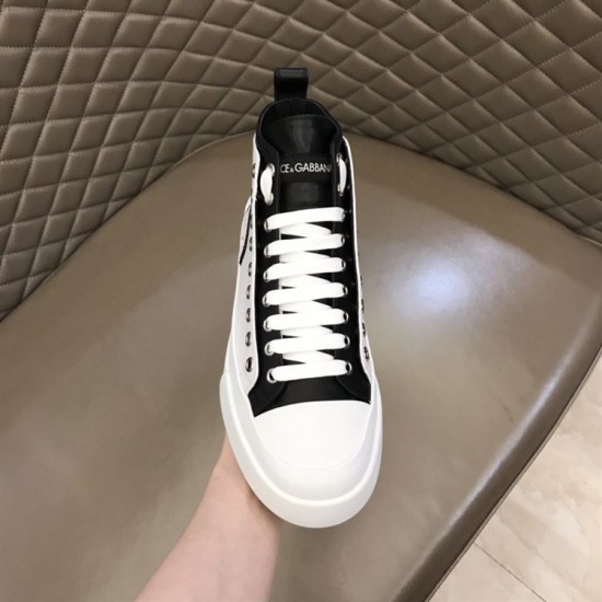 Front perspective of white and black Dolce & Gabbana canvas trainer detailing the eyestays