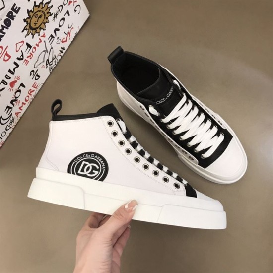 Angled top-down view showing both shoes of the Dolce & Gabbana white mid-top trainer set