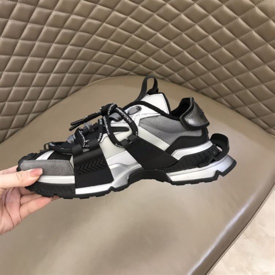 Dolce & Gabbana Space Low-Top Trainers In Black And Grey Handheld View Dolce & Gabbana Space Low-Top Trainers In Black And Grey held in hand