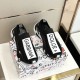 Pair of Dolce & Gabbana Black Stretch Mesh Slip On Trainers top view on box