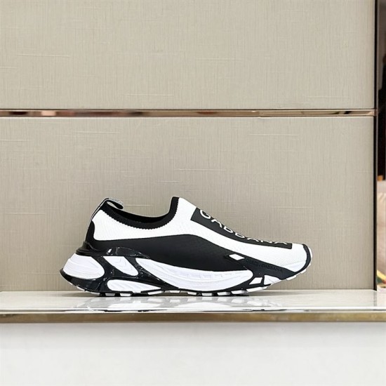 Dolce & Gabbana Slip-On Trainer Profile View in white and black Profile view of Dolce & Gabbana white and black stretch mesh trainer on display shelf