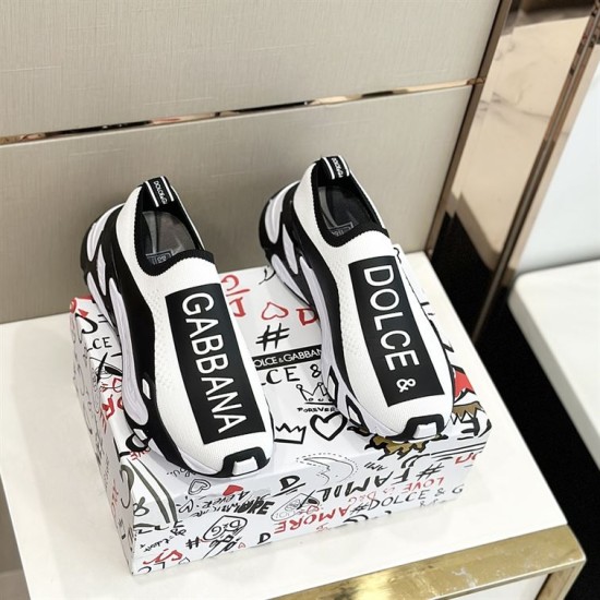 Dolce & Gabbana Trainers Pair Top View in white and black Top-down view of pair of Dolce & Gabbana white and black stretch mesh trainers resting on box