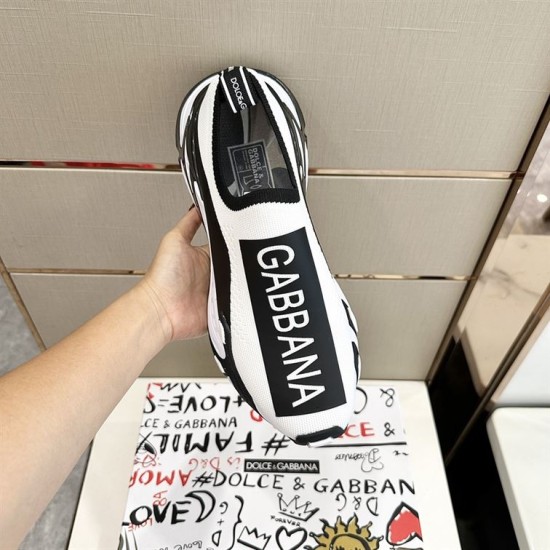 Dolce & Gabbana Trainer Vamp Logo Detail in white and black Overhead view of single Dolce & Gabbana white and black trainer highlighting vamp logo